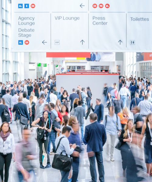 A photo of a crowded trade show